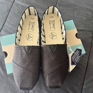 Brand new black Tom’s